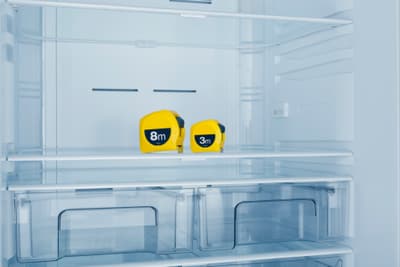 iStock Credit: servet yigit Two tape measurers inside of a refrigerator